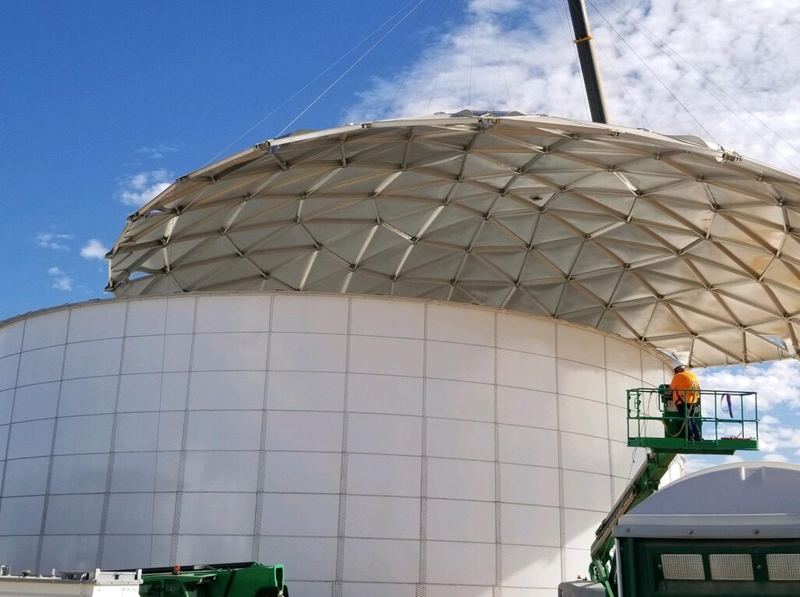 Overhead view of aluminum dome covers on large storage tanks