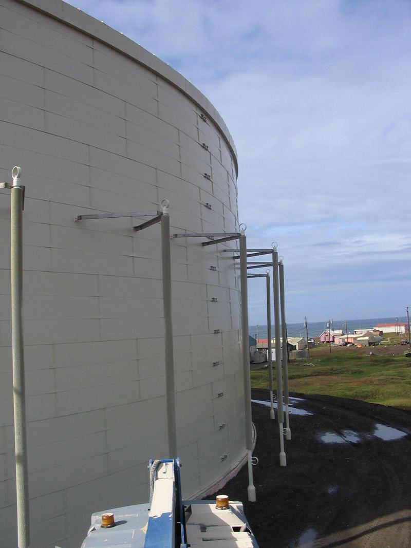 Horizontal panel insulation system on a storage tank sidewall, secured with external metal banding